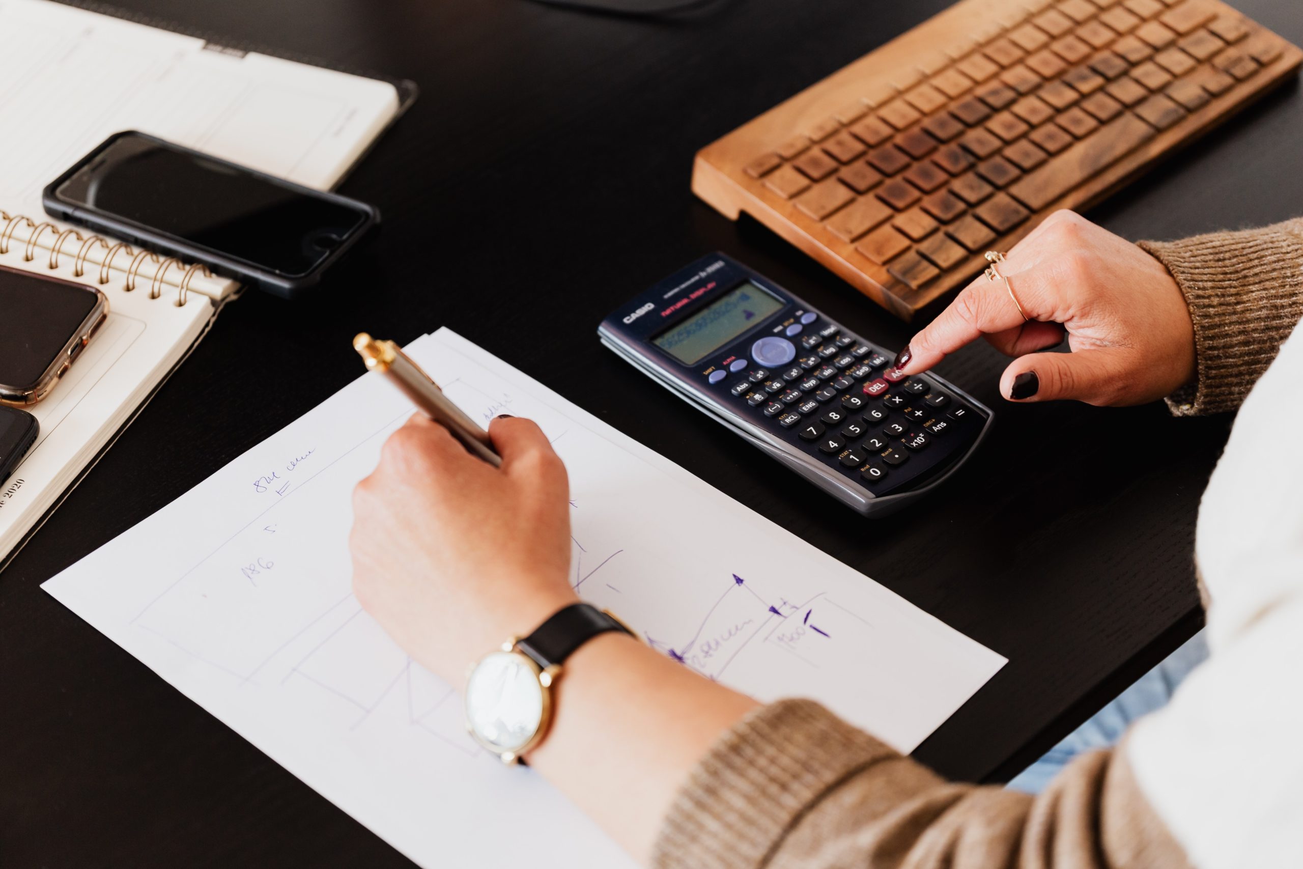 a person using a calculator